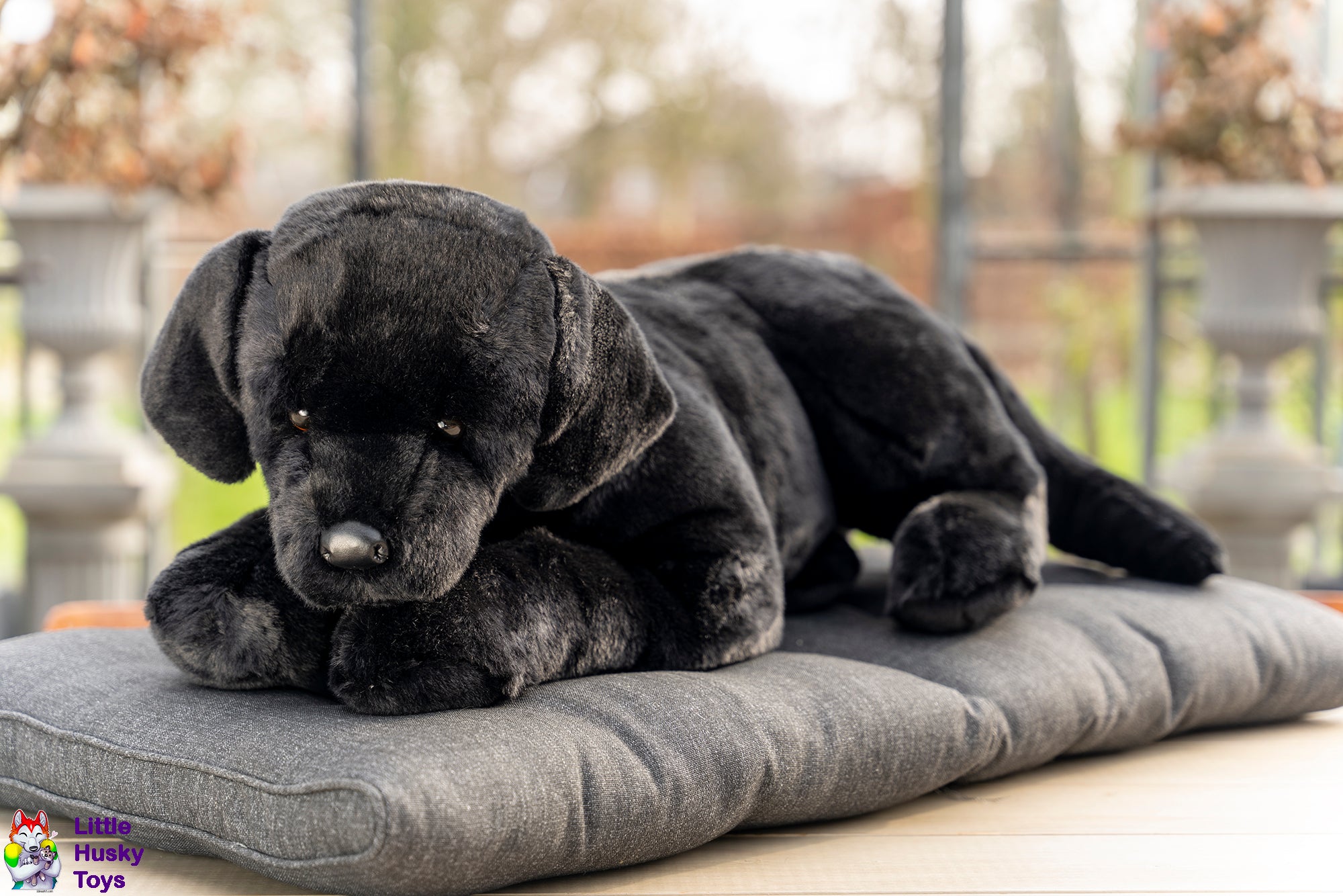 large stuffed black lab